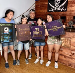 Photo depicts a family of five having fun together at Once Upon an Escape.